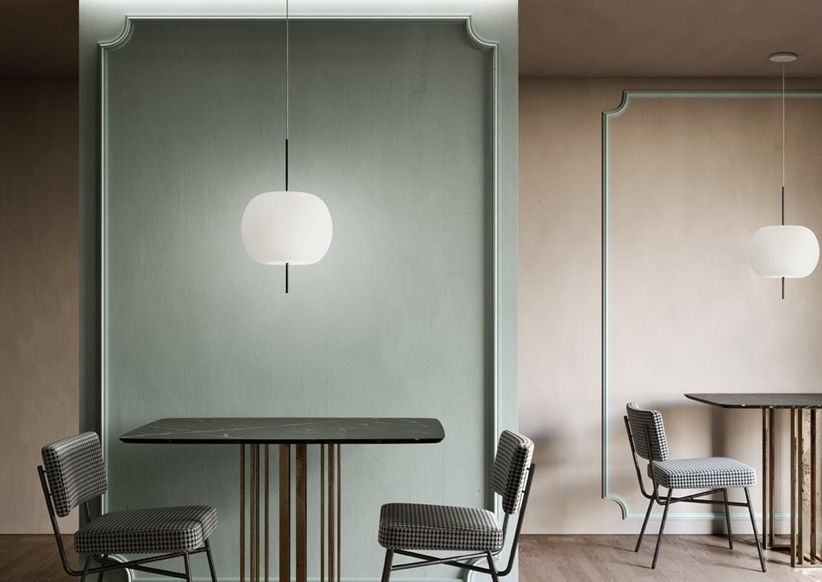 Suspension Kushi de chez Kundalini installée dans un intérieur contemporain, lumière diffuse et design sculptural. Titre